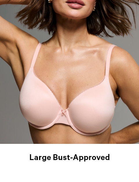 Woman posing in a Victoria's Secret full coverage baby pink bra.