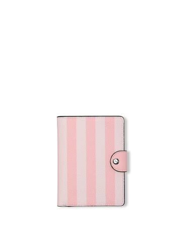 Victoria's Secret siganture stripes passport cover on a light grey background.